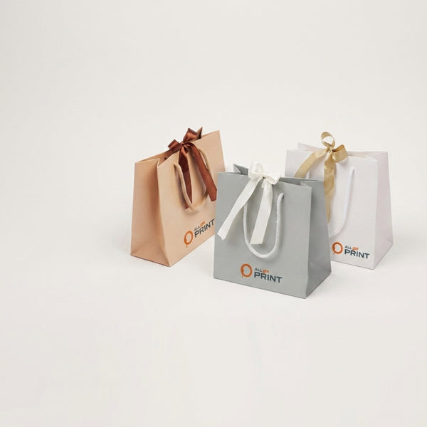 Sample paper carrier bag with gift ribbon